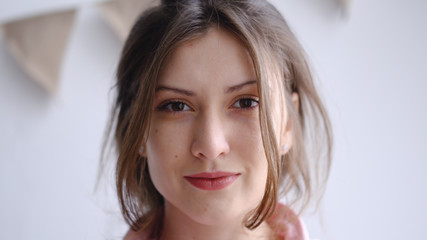 Portrait of a young florist girl in a flower shop