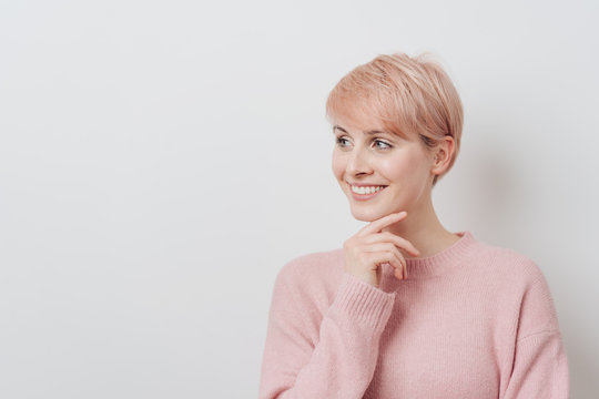 Smiling friendly young blond woman