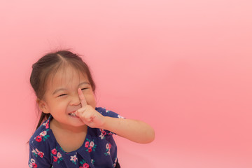 Happy children smile on pink background