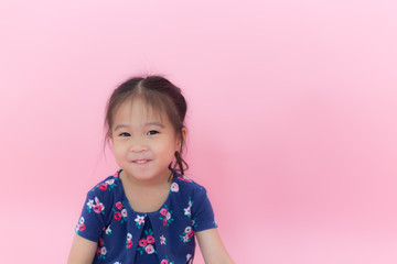 Happy children smile on pink background
