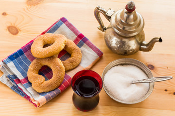 Tea glasses and pot, traditional sweets. Islamic holidays decoration
