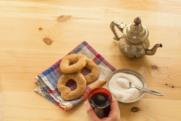 Tea glasses and pot, traditional sweets. Islamic holidays decoration