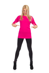 Fototapeta premium Beautiful Slim Woman Is Pointing At Her Waist