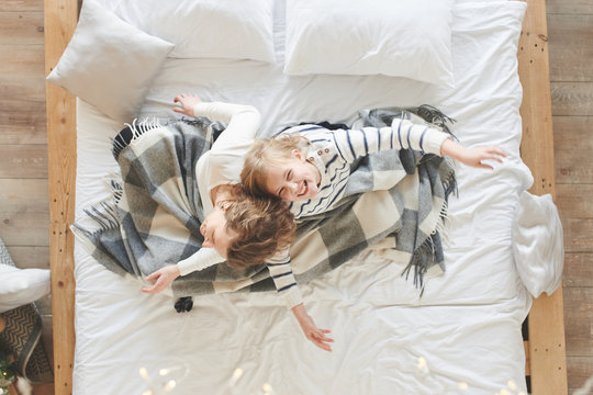 Mom And Daughter On The Bed At Home Throw Pillow