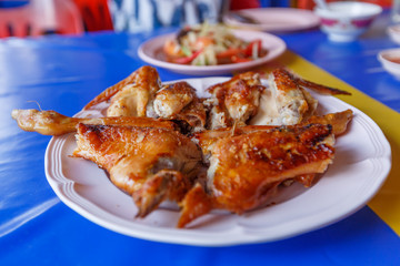 Papaya salad on table,National food of Thailand,Papaya salad and grilled Chicken select focus