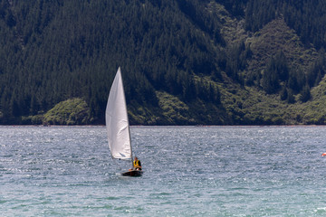 Young man on the sailing boat