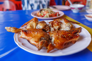 Papaya salad on table,National food of Thailand,Papaya salad and grilled Chicken select focus
