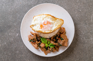 stir-fried pork with basil  on rice and fried egg
