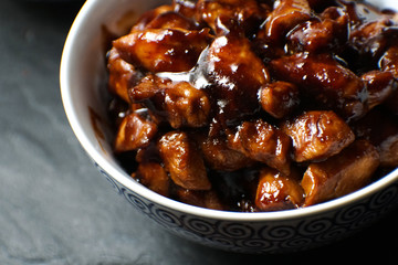 Finished pieces of chicken breast in teriyaki sauce. Asian cuisine