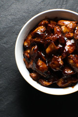 Finished pieces of chicken breast in teriyaki sauce top view. Asian cuisine