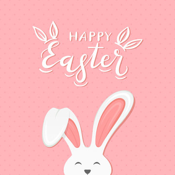 Pink background with text Happy Easter and rabbit ears