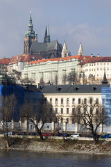 Obraz premium Early Spring Prague gothic Castle with the Lesser Town above River Vltava in the sunny Day, Czech Republic