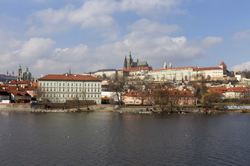 Naklejka na ściany i meble Early Spring Prague gothic Castle with the Lesser Town above River Vltava in the sunny Day, Czech Republic