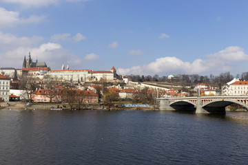 Fototapeta na wymiar Early Spring Prague gothic Castle with the Lesser Town above River Vltava in the sunny Day, Czech Republic