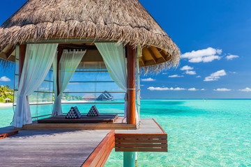 Overwater spa in the tropical blue lagoon of Maldives