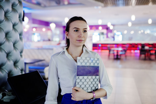 Waiter girl holding menu at cafe. People and service concept