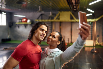 Couple making selfie in the gym