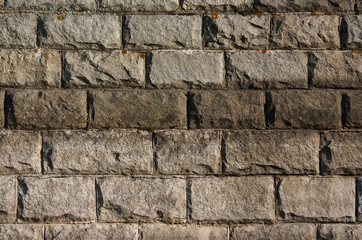 Naklejka premium background of a large old brick, gray large brick