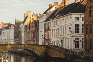 Fototapeta na wymiar beautiful colorful houses, old bridge and canal in brugge, belgium