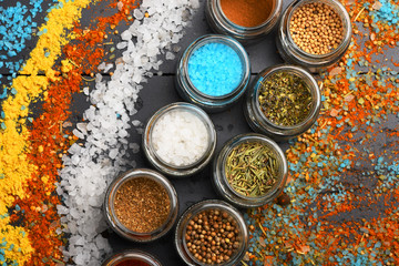 Food art concept. Composition of bottles with colored herbs