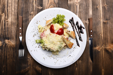 Salad made of chicken, vegetables and croutons