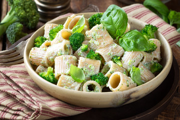 Vegetarian whole grain pasta with creamy broccoli sauce and basil