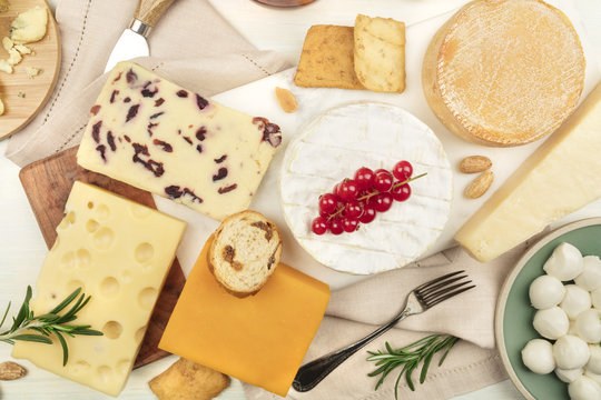 Various types of cheese on a light background