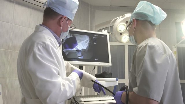 doctor and assistant doctor prepare medical equipment in the operating room