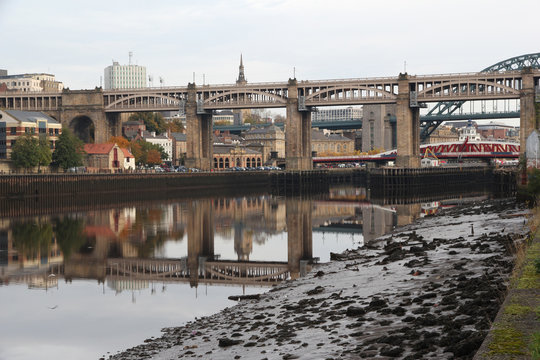 Newcastle-Upon-Tyne’s High Level Bridge showing a near perfect reflection in the River Tyne. Swing and Tyne bridge can also be seen in the background
