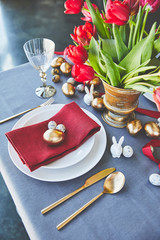 High angle view of easter eggs and flowers on festive table in restaurant