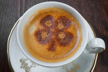 Closeup of cup of coffee with pattern and nice design