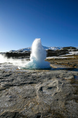 Water geyser in the Island on the blue sky background 