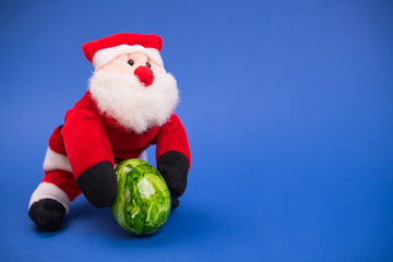 little santa claus with green easter egg