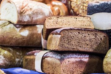 freshly baked bread and bakery products. focus on bread in the foreground. soft focus