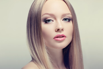 Fototapeta premium Beauty Woman Portrait. Perfect Fresh Skin. healthy well-groomed hair. Youth and Skin Care Concept.