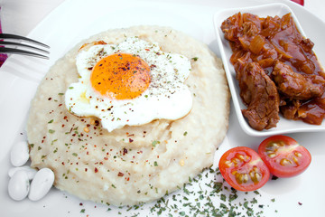 Delicious beef meat with onion, bean side dish and egg