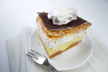 Sweet French delicious chocolate and cream cake - French cube - Kremes