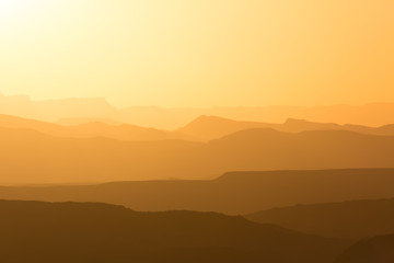 mountain silhouette in the Negev desert in Israel at sunset sunrise - obrazy, fototapety, plakaty