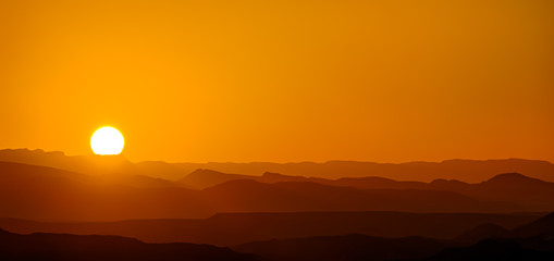 mountain silhouette in the Negev desert in Israel at sunset sunrise
