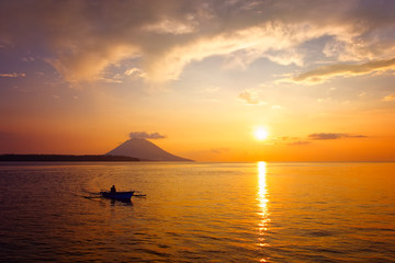 Traditional Indonesian boat in the beautiful golden sunset