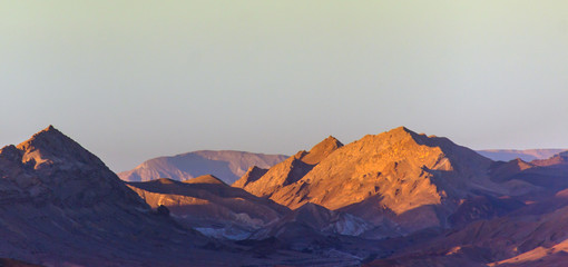 Mountains in the desert at sunrise sunset