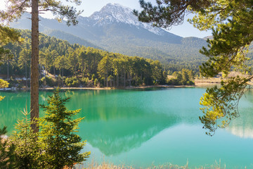 Lake doxa in Greece. View through the trees.
