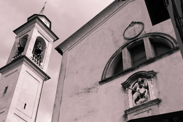 Detail of the bell tower of an ancient small Catholic church.