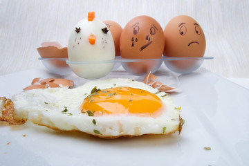 Funny egg faces with daring of sad emotions afraid of cooking