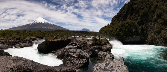 Panoramic view of Saltos del Petrohue waterfalls and Osorno Volcano in Vicente Perez Rosales...