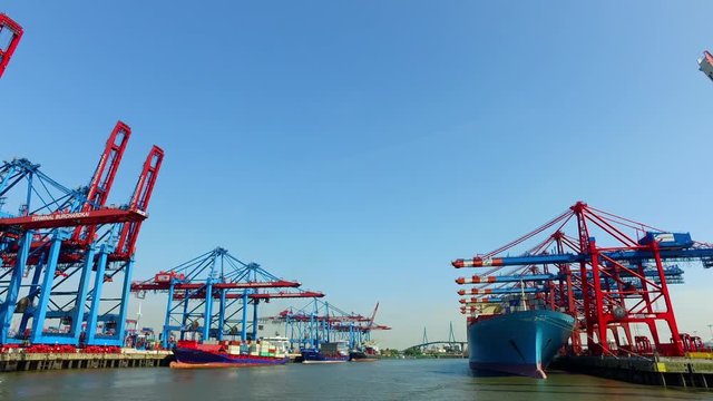 Container ships unload or load their cargo in the Port of Hamburg at the Burchartkai and Eurokai, Germany.