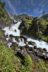 Fototapeta na wymiar Beautiful waterfalls in the Norwegian mountains, Norway, Scandinavia