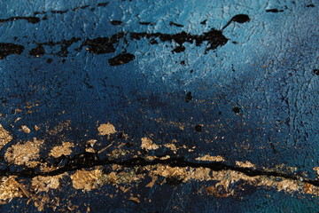 Blue painting acrylic with metal flakes. Drops, lines, arrows close up