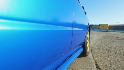 Speed challenge by blue car driver, stuntman danger profession, test drive