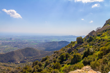 View from the mountains to the island of Cyprus, on a background of green forest and mountains